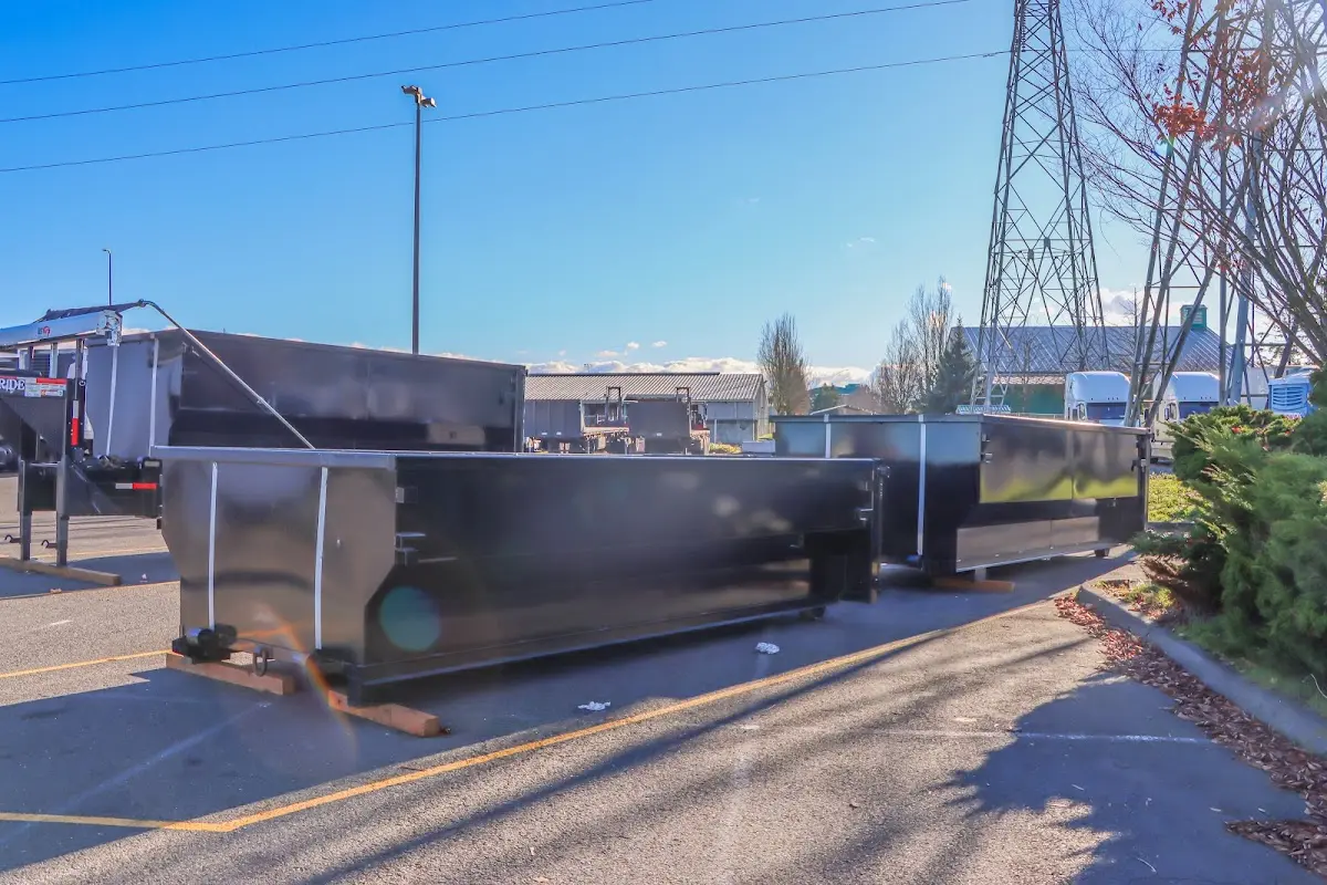 Roll-off dumpster ready for waste disposal at job site for Yard Waste Dumpster Rental in Pleasant Hill